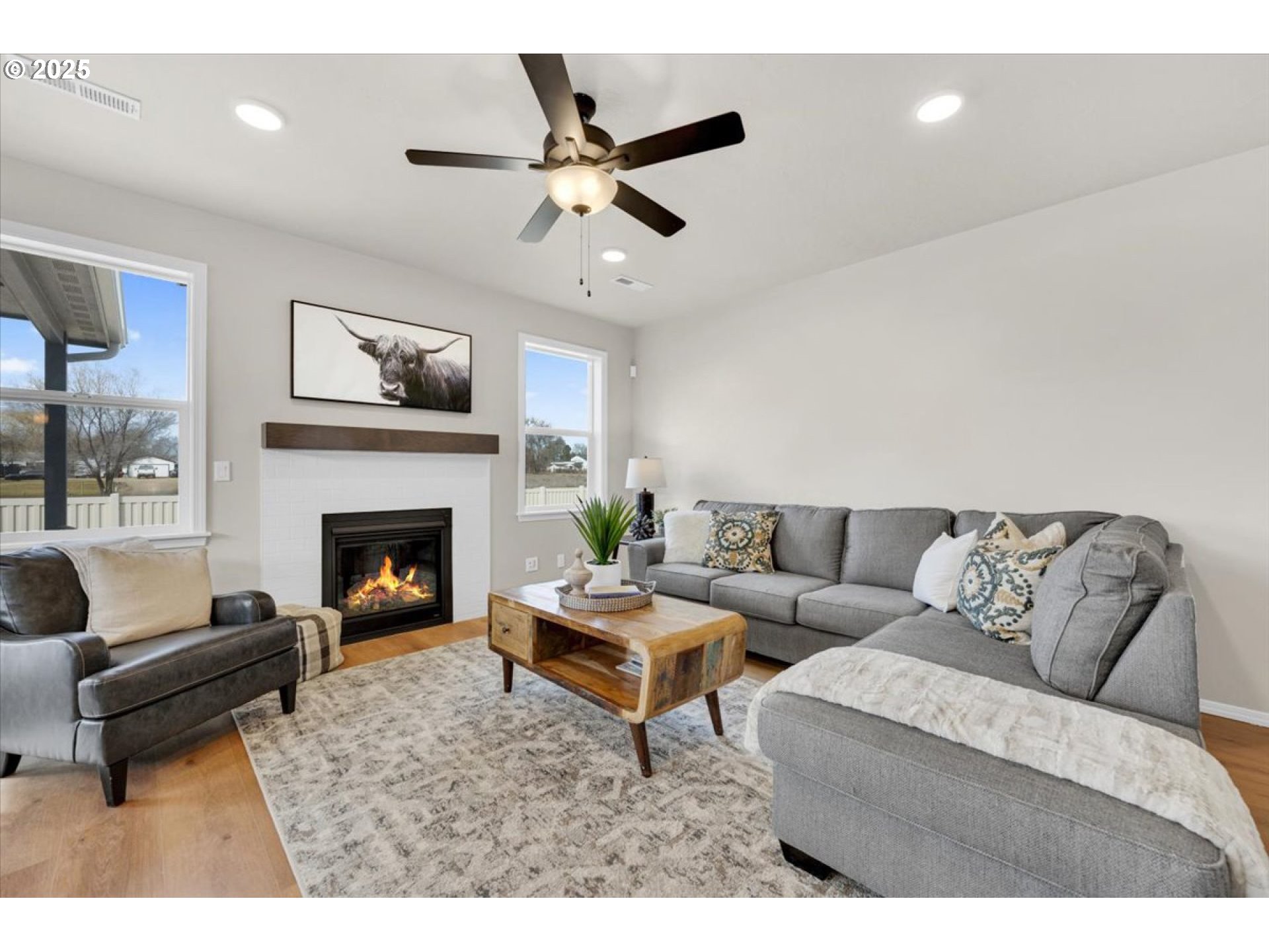 5190 Holly Street Springfield, OR 97478 - Photo 2 of 11 a living room with furniture a clock and a fireplace