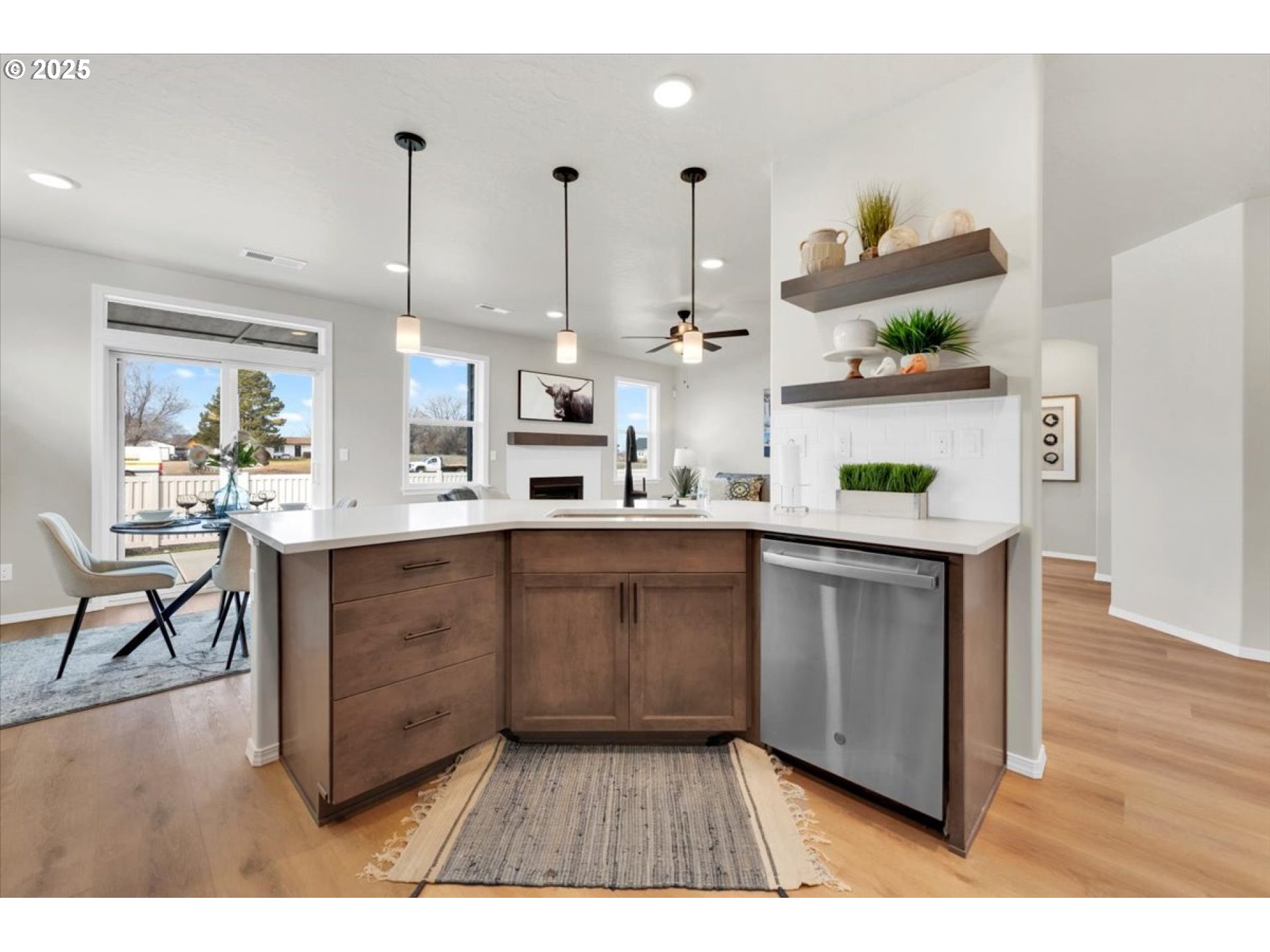 5190 Holly Street Springfield, OR 97478 - Photo 4 of 11 a kitchen with stainless steel appliances granite countertop a refrigerator a sink dishwasher a stove with wooden floor