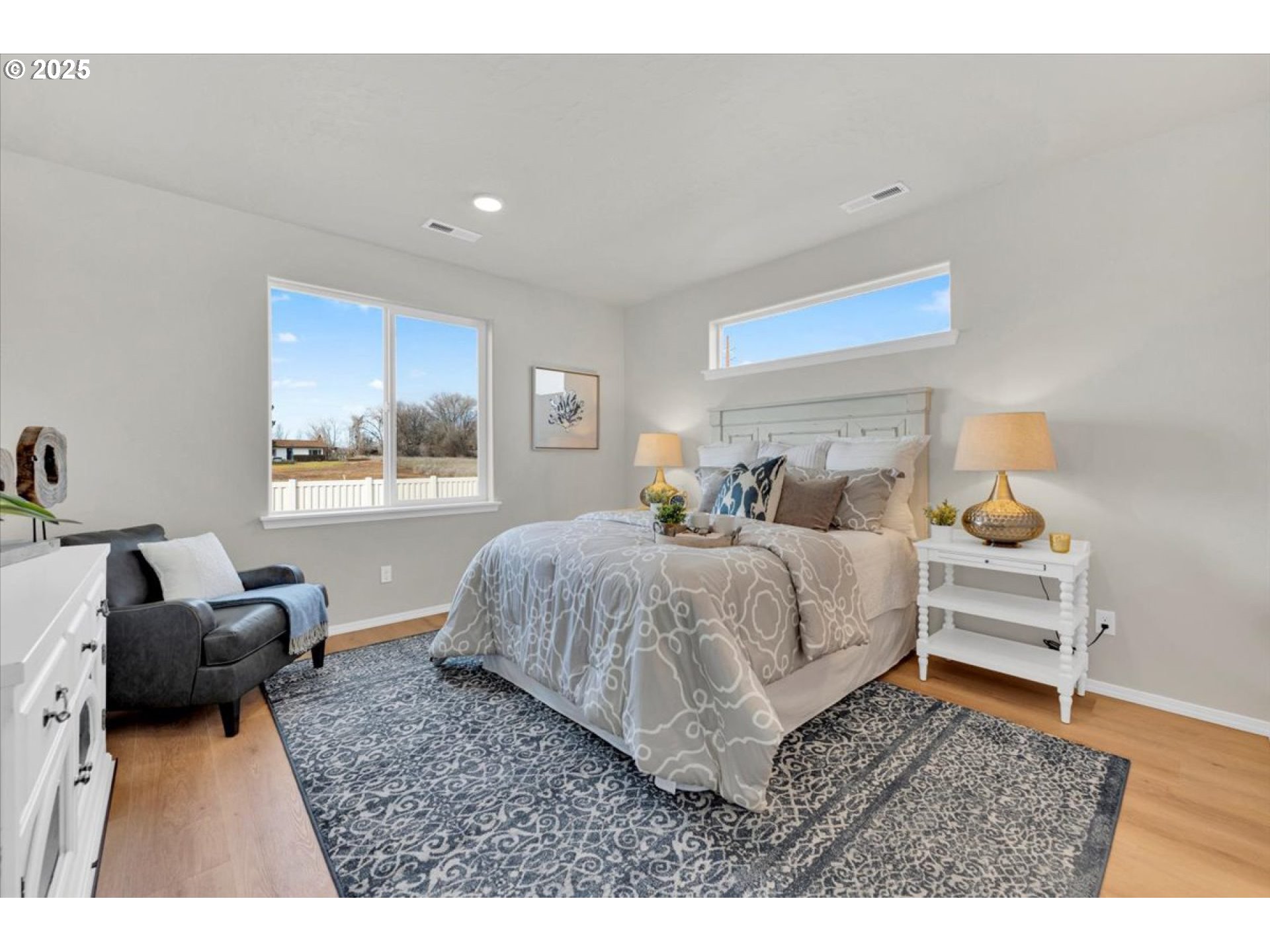 5190 Holly Street Springfield, OR 97478 - Photo 7 of 11 a bedroom with a bed and wooden floor