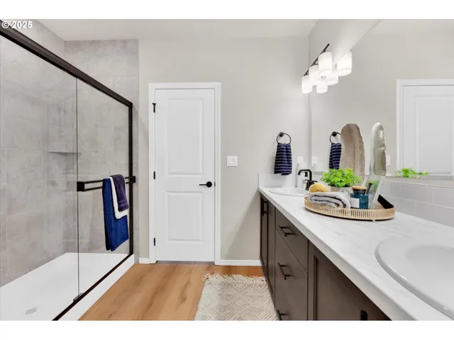 a bathroom with a sink a mirror and vanity