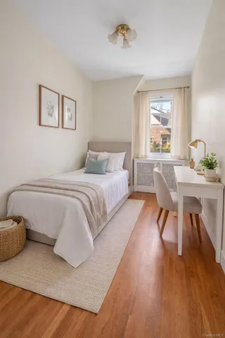 a bedroom with a bed and a table