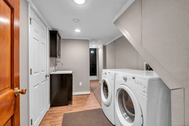 a view of a hallway with washer and dryer