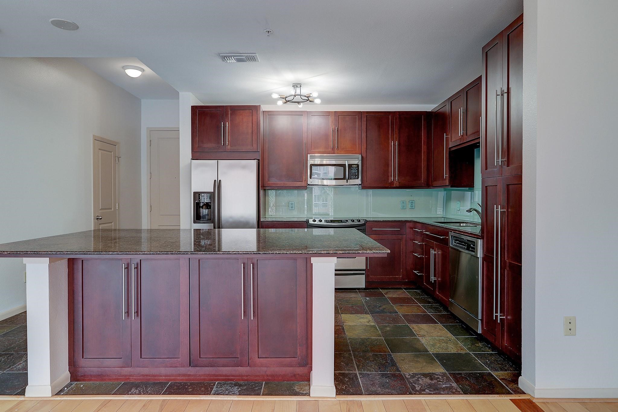 3505 Sage Road, Unit 207 Houston, TX 77056 - Photo 7 of 21 The expansive kitchen island has enough room to seat at least 3 people.