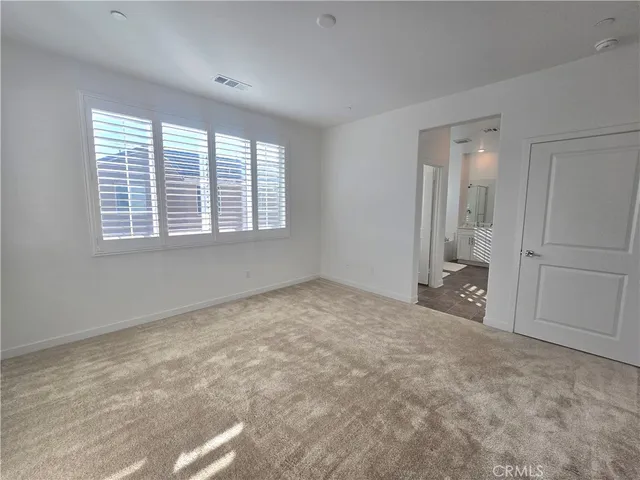 a bathroom with a sink mirror and vanity