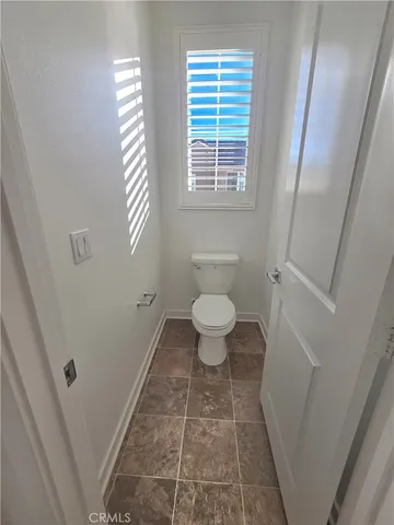 a bathroom with a tub sink and toilet