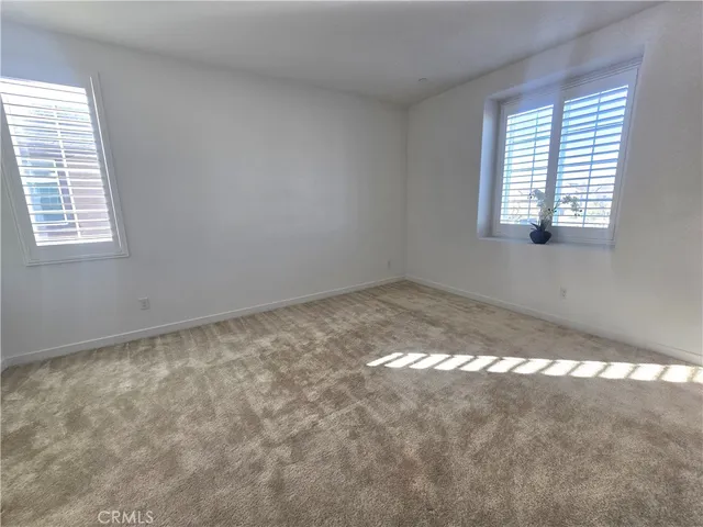 a view of a backyard with sitting area