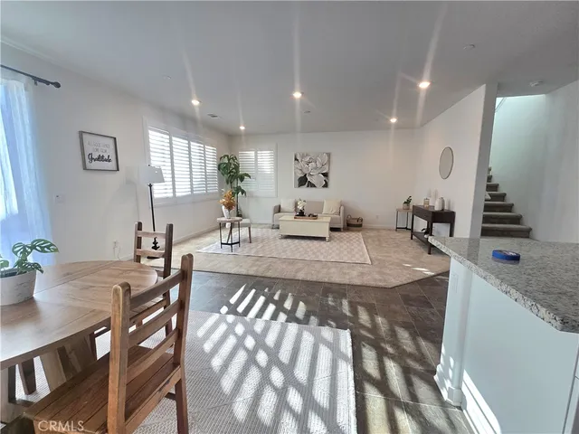 a kitchen with stainless steel appliances kitchen island granite countertop a sink and cabinets