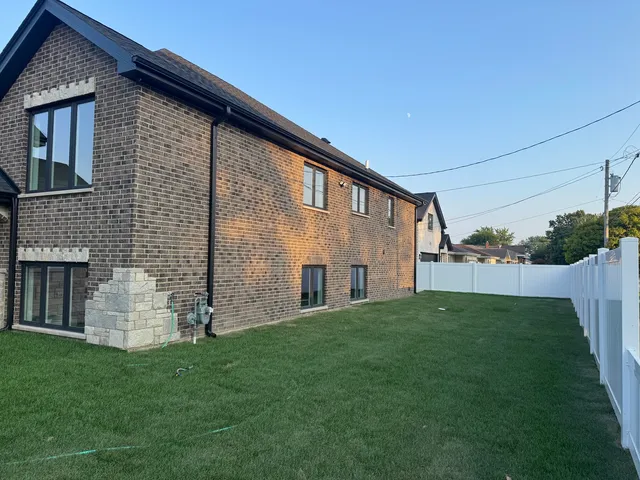 a brick house with a yard