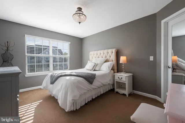 a view of a livingroom with furniture and closet