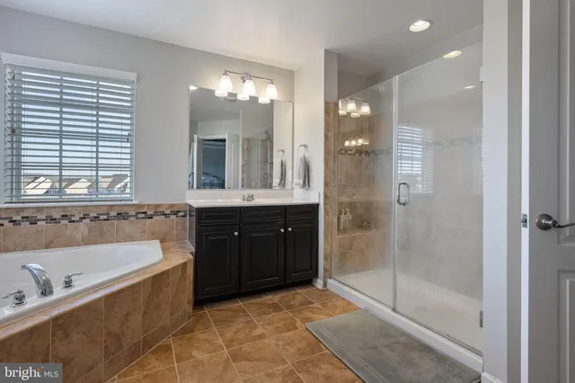 a bedroom with a bed and a table