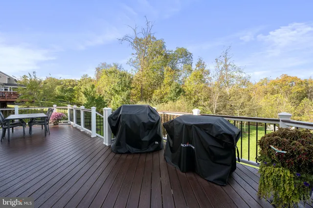 a bedroom with a bed chair and a window