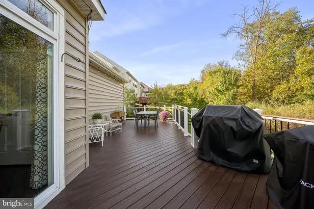 a bedroom with a bed and a chair