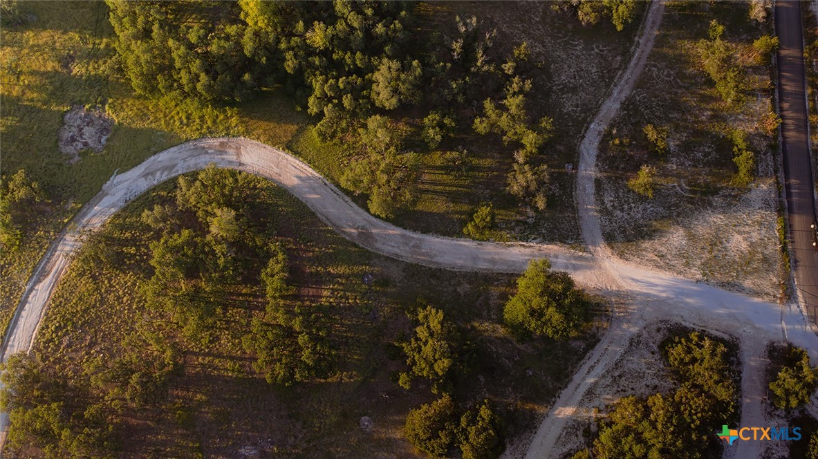 98.73 Acres Triple 3 Ranch Blanco, TX 78606 - Photo 6 of 24 a stone house with a yard and a outdoor space