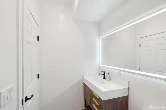 a bathroom with a sink and a mirror