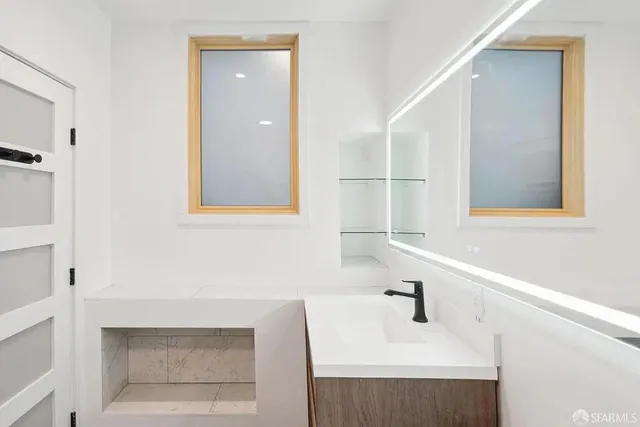 a view of a patio with dining table and chairs and potted plants