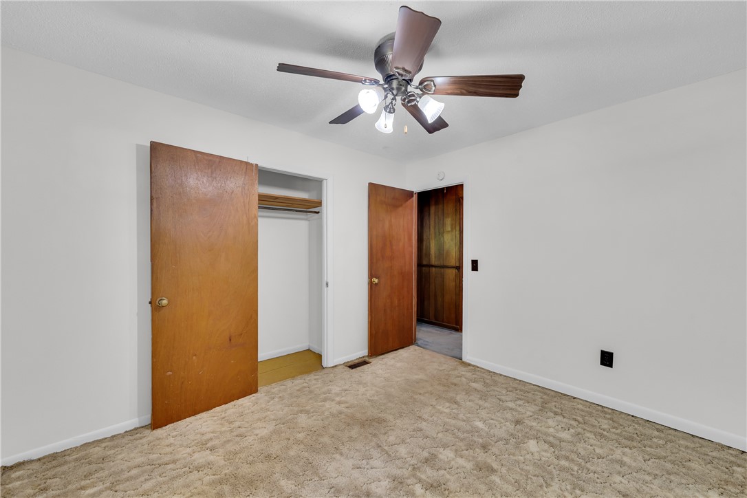 952 Stephens Drive Westminster, SC 29693 - Photo 33 of 50 A well-lit bedroom features carpeting and a convenient ceiling fan for comfort.