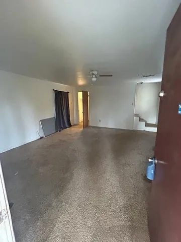 a view of a livingroom and a window