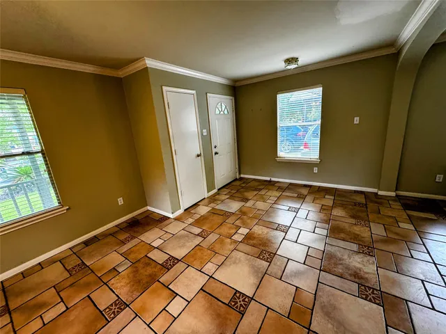 a view of an empty room and window