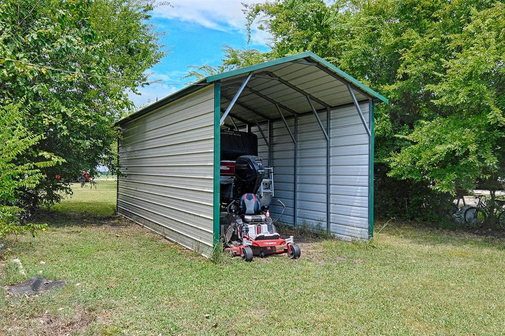 1670 Smith Circle Combine, TX 75159 - Photo 2 of 31 View of outbuilding featuring a detached carport