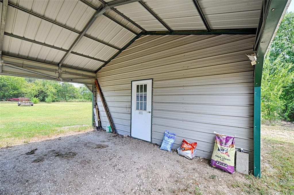 1670 Smith Circle Combine, TX 75159 - Photo 3 of 31 Garage featuring a carport
