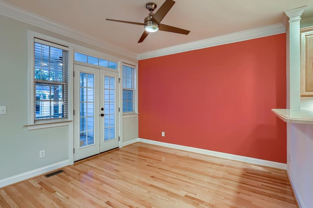 10907 Flower Bed Court Raleigh, NC 27614 - Photo 11 of 28 a view of empty room with wooden floor and fan