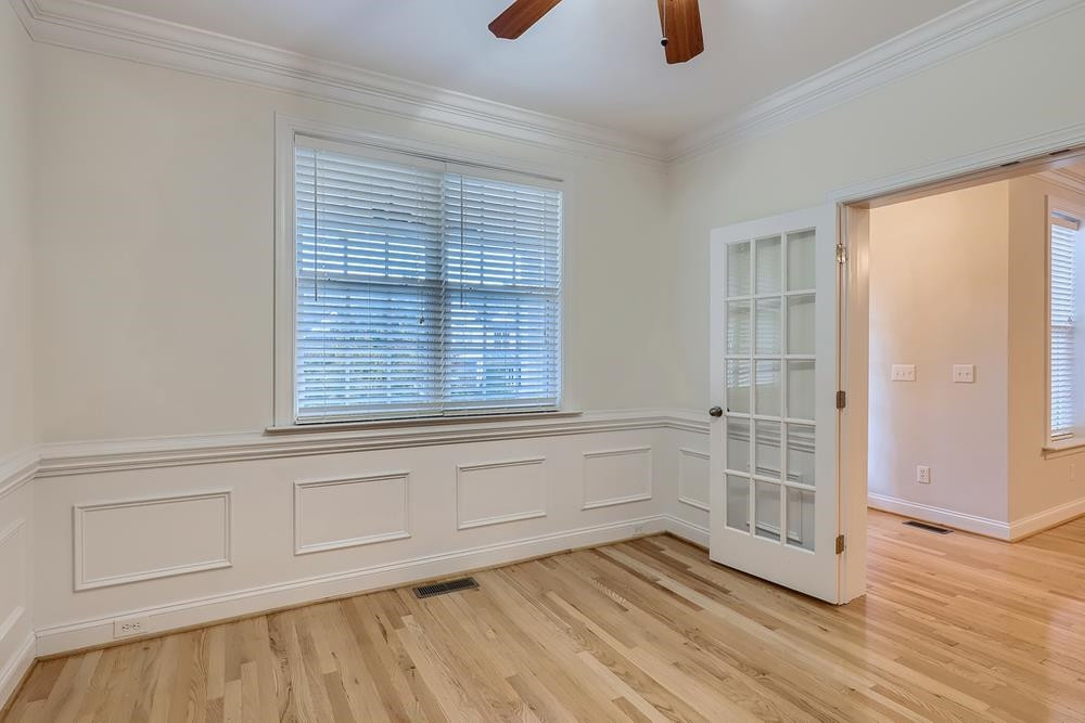 10907 Flower Bed Court Raleigh, NC 27614 - Photo 12 of 28 an empty room with wooden floor and windows