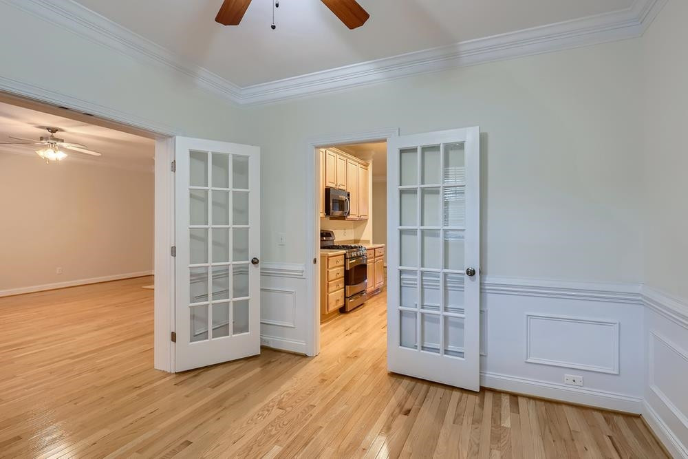 10907 Flower Bed Court Raleigh, NC 27614 - Photo 13 of 28 an empty room with wooden floor and windows