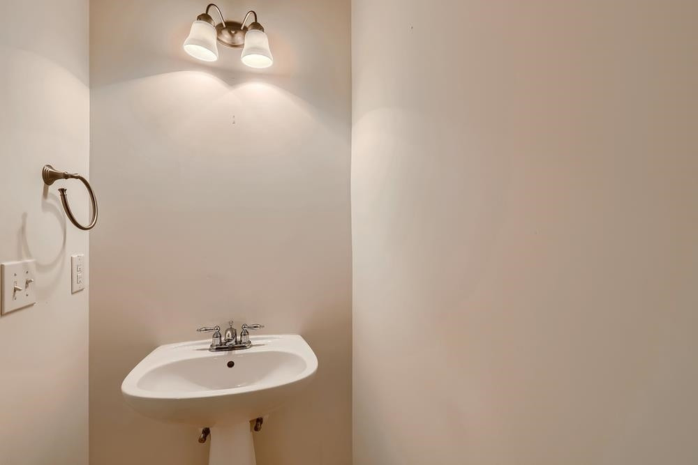 10907 Flower Bed Court Raleigh, NC 27614 - Photo 14 of 28 a bathroom with a sink and mirror