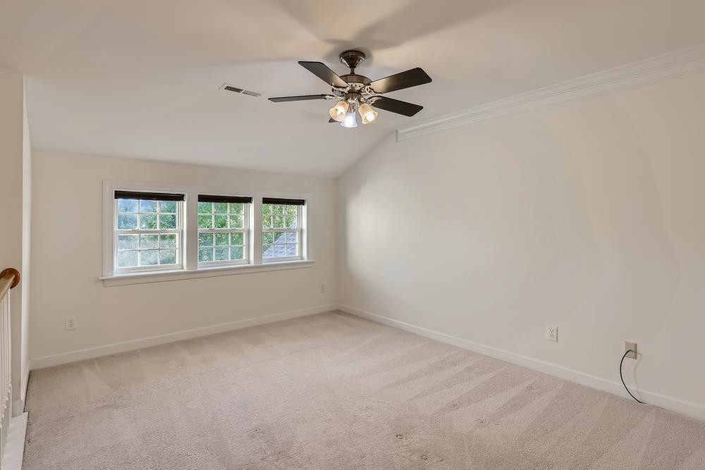 10907 Flower Bed Court Raleigh, NC 27614 - Photo 23 of 28 a view of a livingroom with a ceiling fan and window