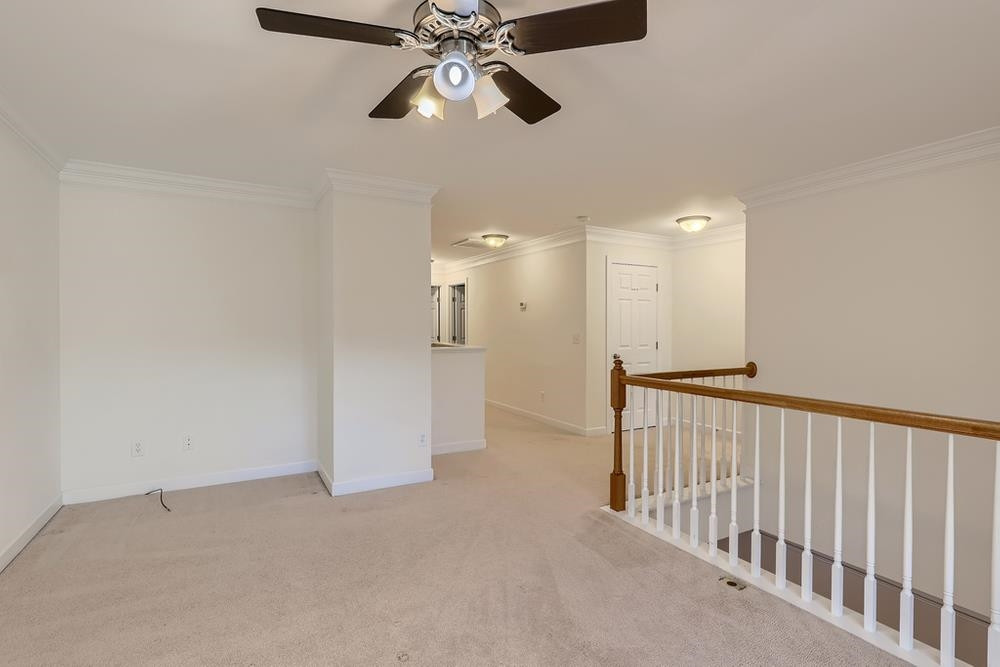 10907 Flower Bed Court Raleigh, NC 27614 - Photo 24 of 28 a view of a hallway with a chandelier fan