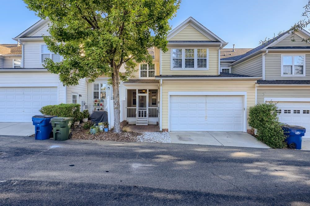 10907 Flower Bed Court Raleigh, NC 27614 - Photo 27 of 28 a front view of a house with a yard and garage