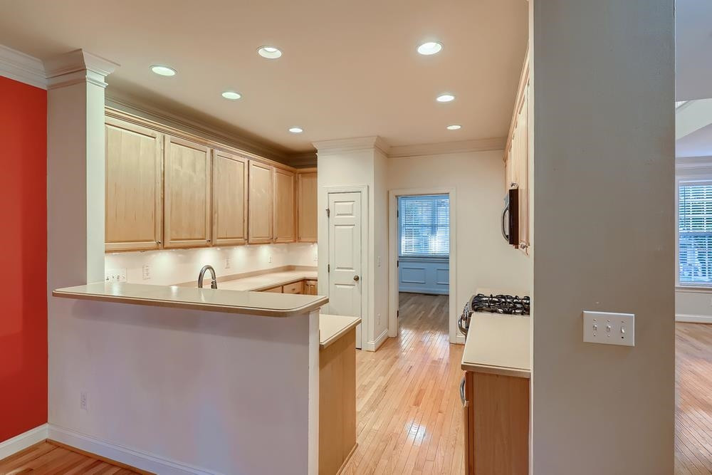 10907 Flower Bed Court Raleigh, NC 27614 - Photo 7 of 28 a kitchen with a sink appliances and cabinets
