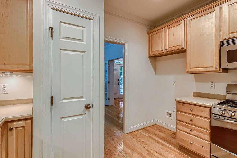 10907 Flower Bed Court Raleigh, NC 27614 - Photo 10 of 28 a view of kitchen with wooden floor and electronic appliances