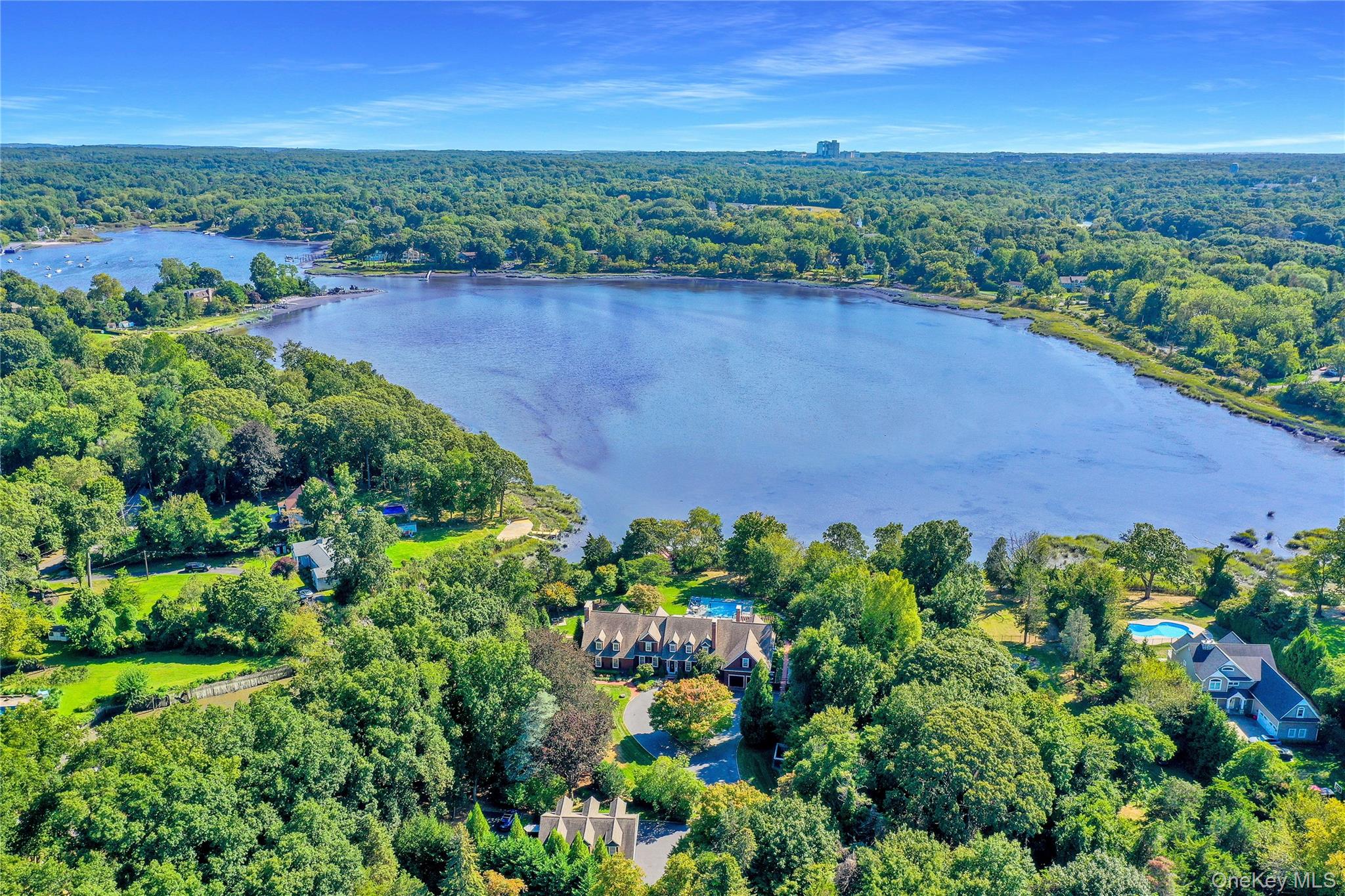63 Dyke Road Setauket, NY 11733 - Photo 1 of 49 Aerial view of property's location featuring a forest and a nearby body of water