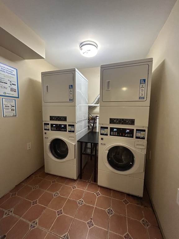 435 Walnut Avenue, Unit 10 Boston, MA 02119 - Photo 18 of 18 a utility room with sink dryer and washer