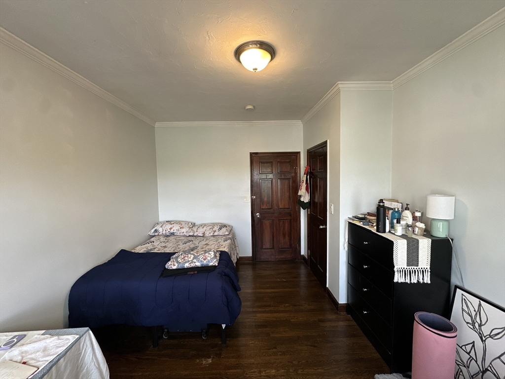 435 Walnut Avenue, Unit 10 Boston, MA 02119 - Photo 10 of 18 a living room with furniture