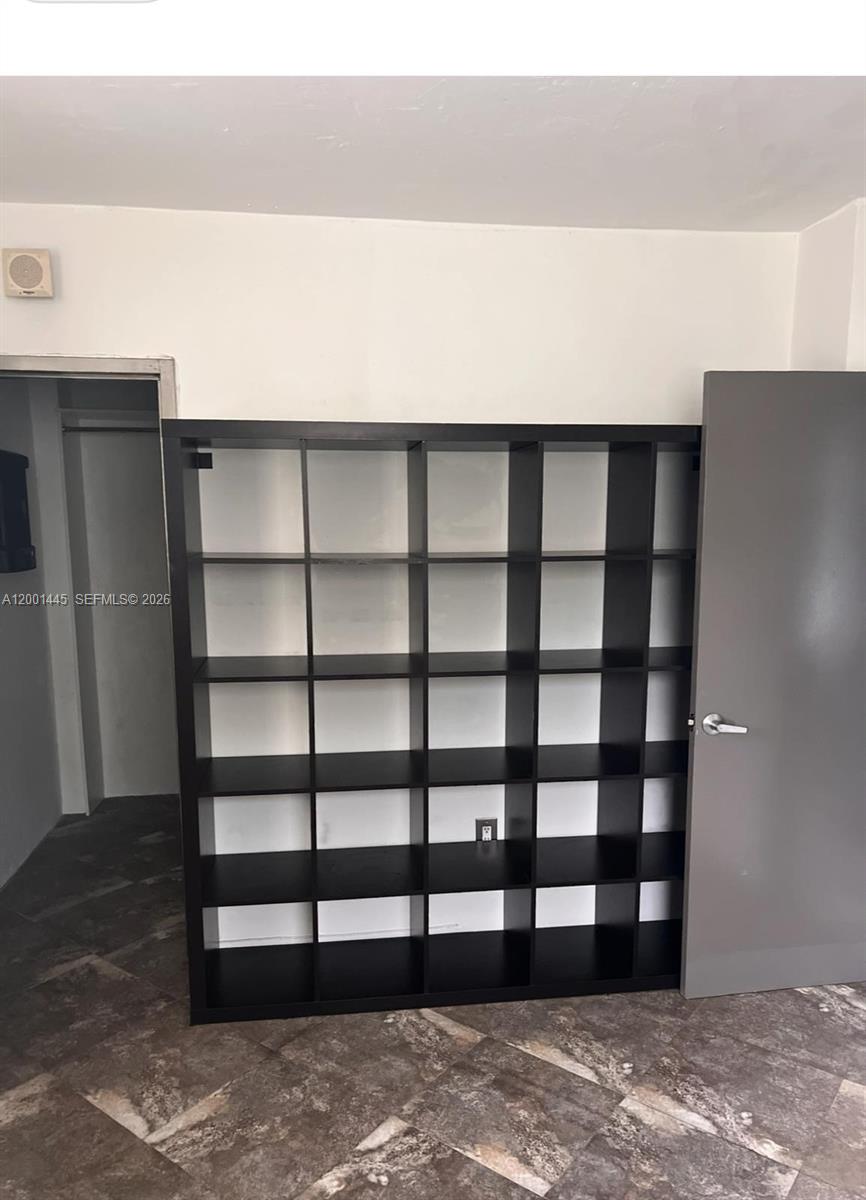 1300 Lincoln Road, Unit A301 Miami Beach, FL 33139 - Photo 12 of 23 a view of wooden floor and windows in a room