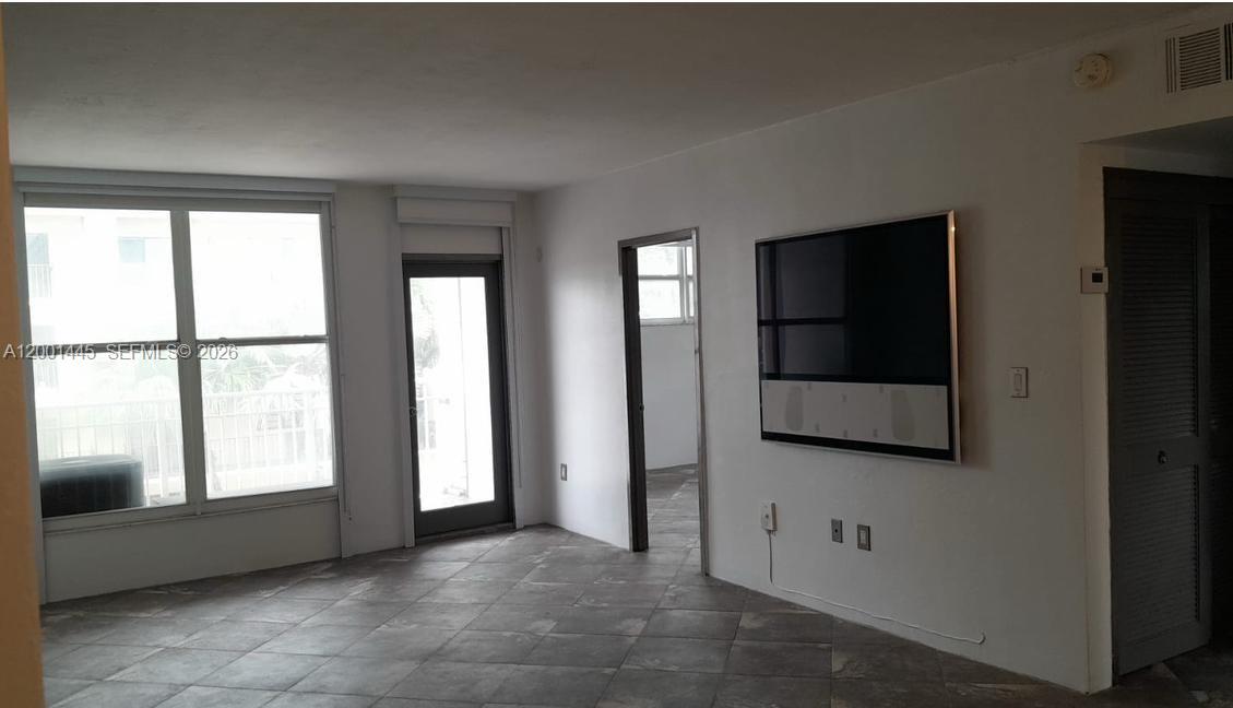 1300 Lincoln Road, Unit A301 Miami Beach, FL 33139 - Photo 13 of 23 a view of an empty room and window