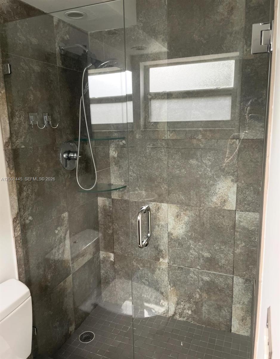 1300 Lincoln Road, Unit A301 Miami Beach, FL 33139 - Photo 22 of 23 a bathroom with a shower