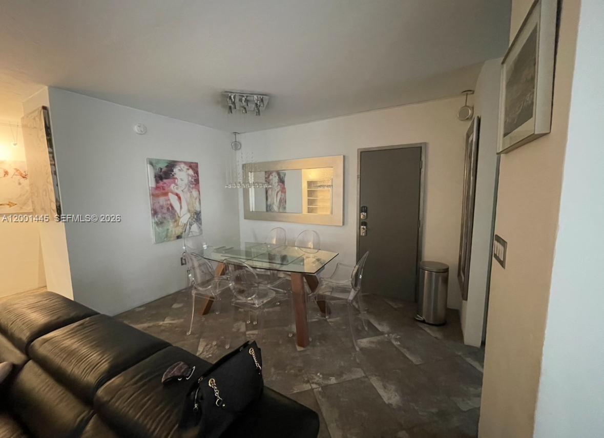 1300 Lincoln Road, Unit A301 Miami Beach, FL 33139 - Photo 9 of 23 a view of a livingroom with furniture and window
