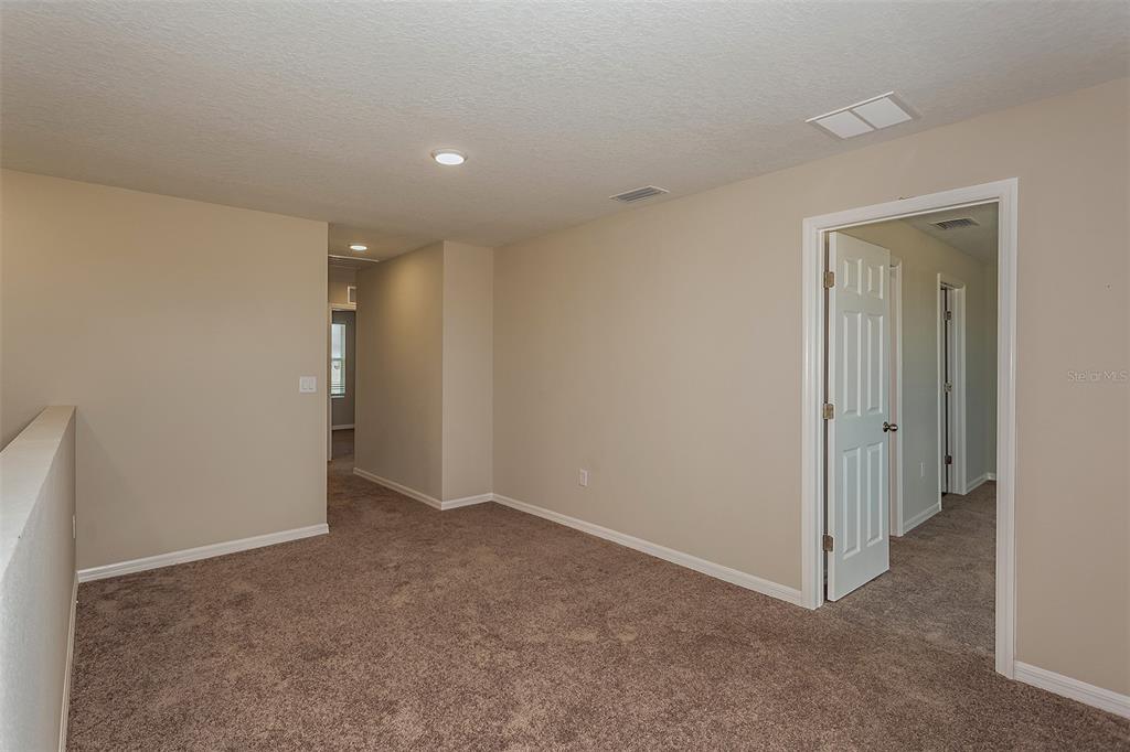 15232 Maude Lndg Loop Wimauma, FL 33598 - Photo 21 of 22 a view of an empty room