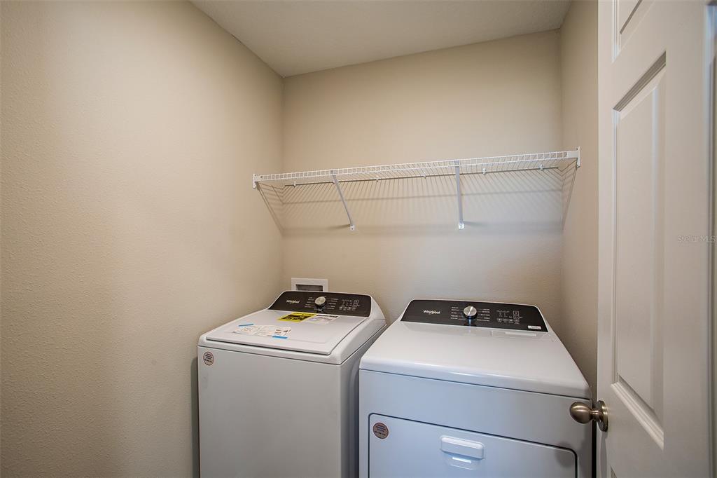 15232 Maude Lndg Loop Wimauma, FL 33598 - Photo 22 of 22 a utility room with dryer and washer