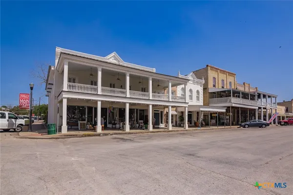 a front view of a building with a street