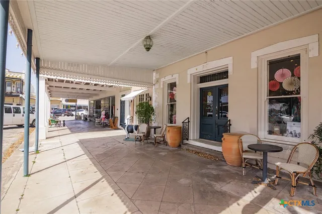 a lobby with furniture and rug