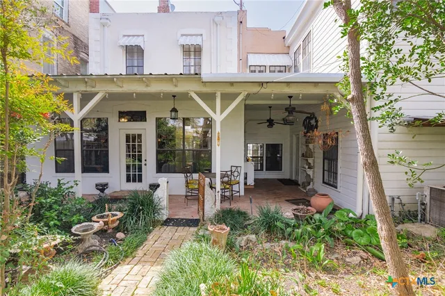 a view of a building with sitting area