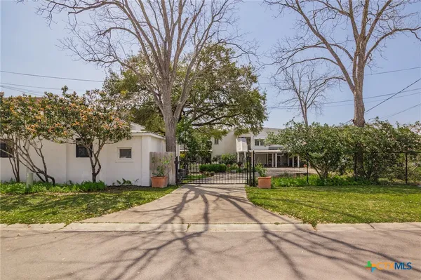 a house with trees in front of it