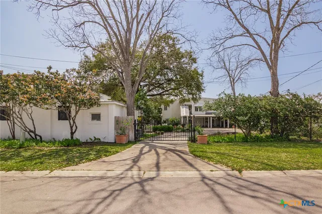 a house with trees in front of it