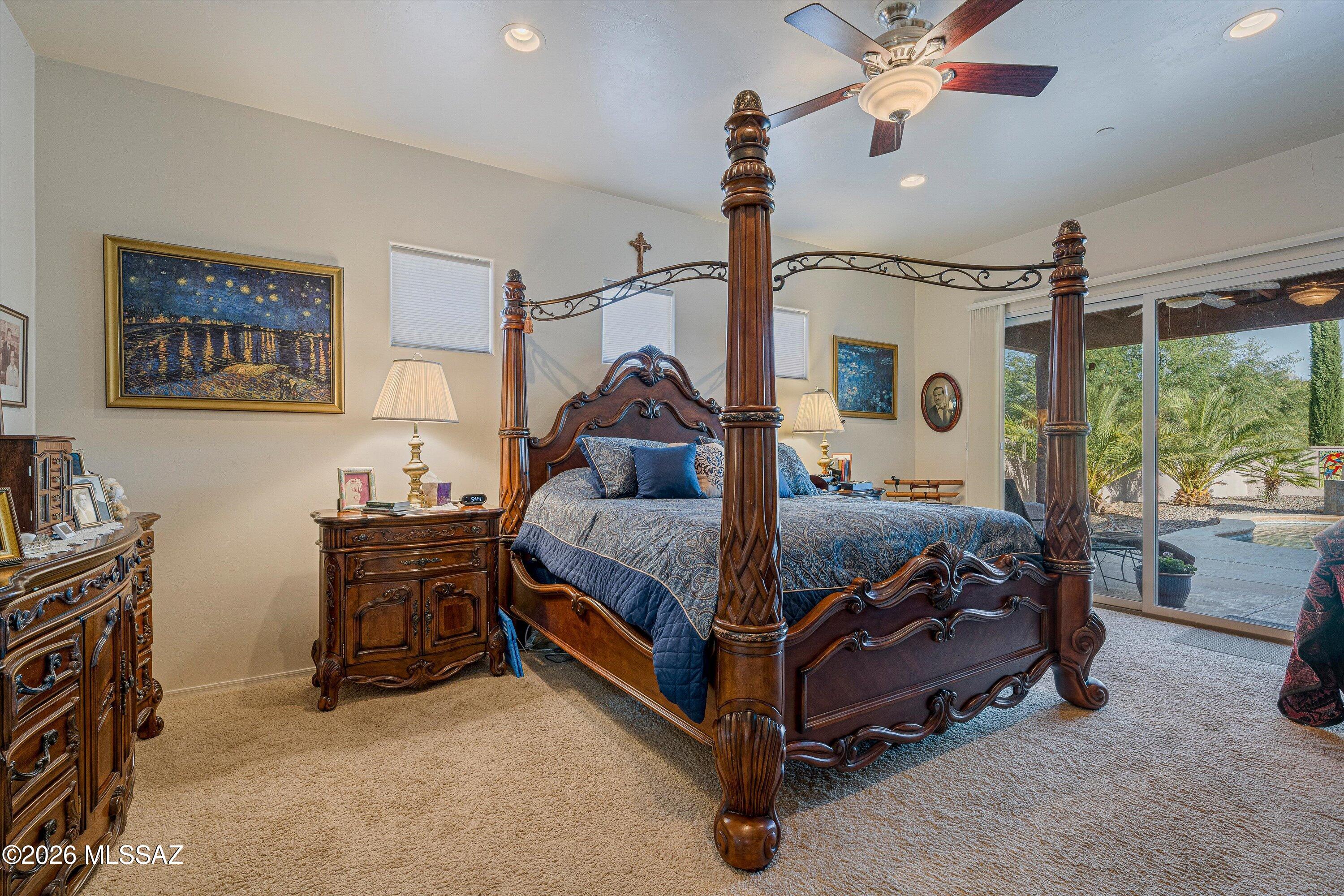 4677 East Rail N Road Tucson, AZ 85739 - Photo 12 of 48 Left from great room and kitchen is the primary en-suite, mountain views walk in tiled shower, soaking tub, walk in closet and patio door to backyard oasis