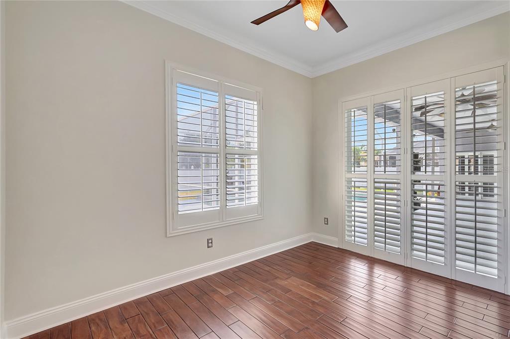 2863 Duncan Tree Circle Valrico, FL 33594 - Photo 43 of 53 an empty room with wooden floor and windows