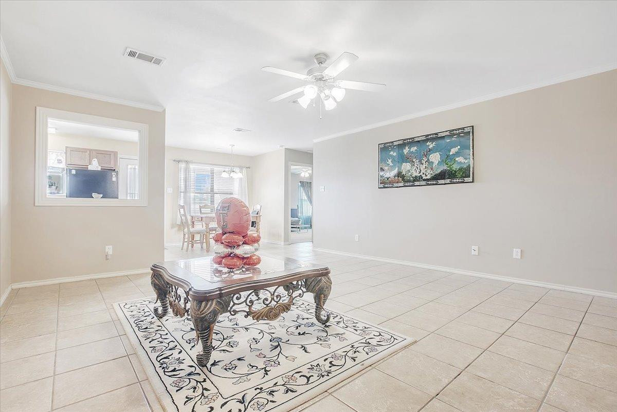 903 Xavier Street Lubbock, TX 79403 - Photo 11 of 28 a living room with furniture and wooden floor